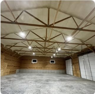 Closed-cell spray foam finished on a shop ceiling
