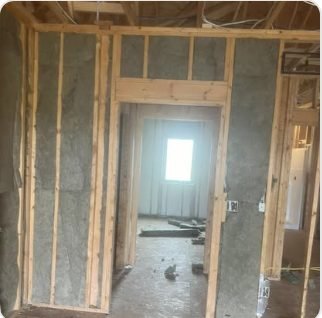 Foam-sealed wall cavities around a doorway